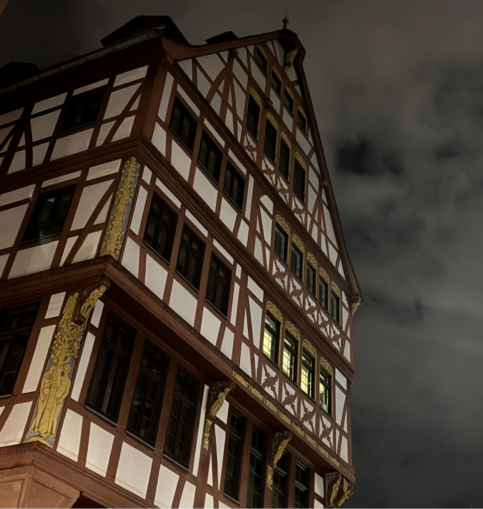A beautifully illuminated house in Germany at night.