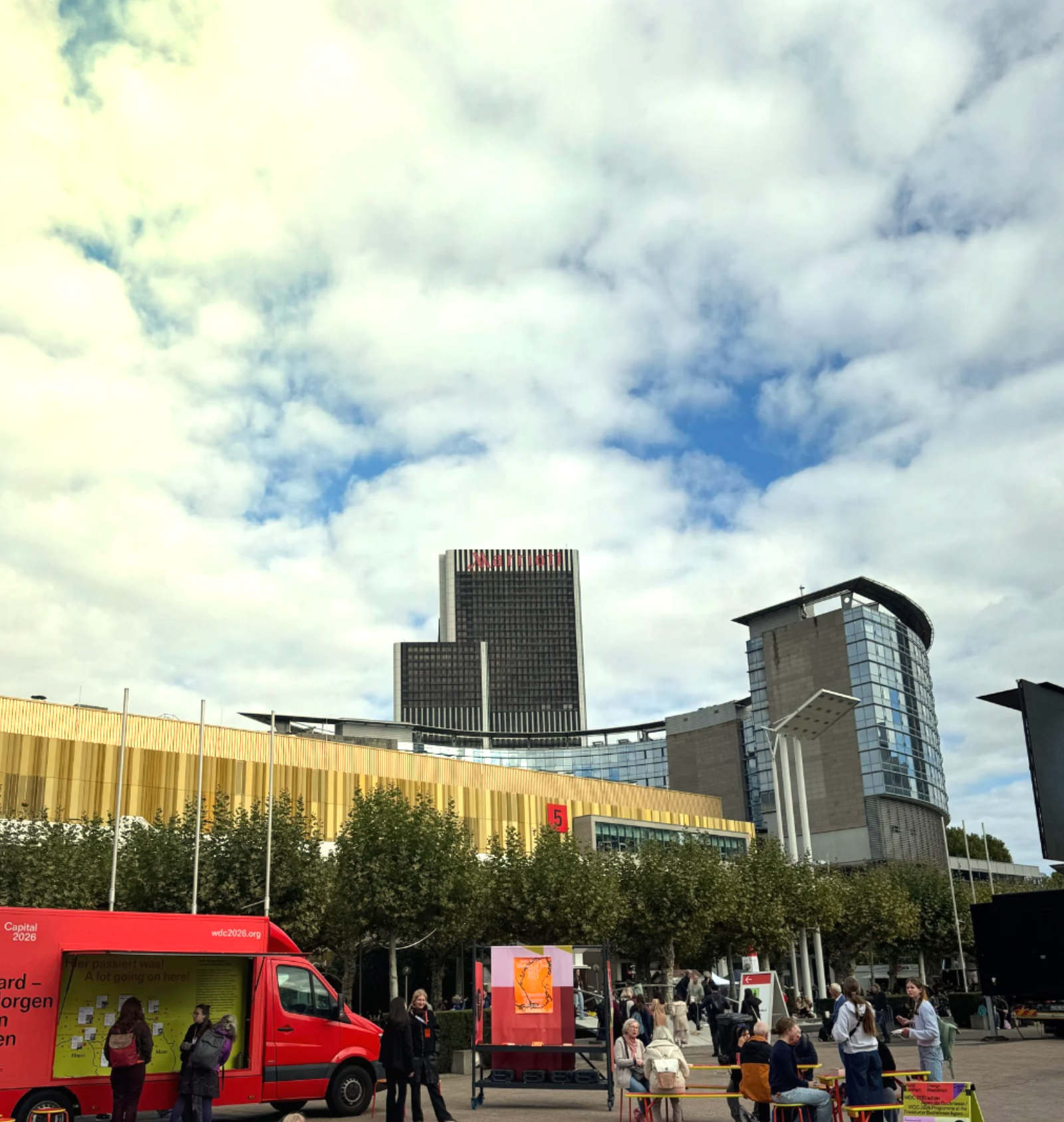 Sunny view of Frankfurt city with clear skies and urban architecture.